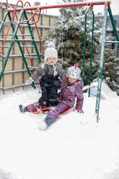 Children playing in the snow outdoor