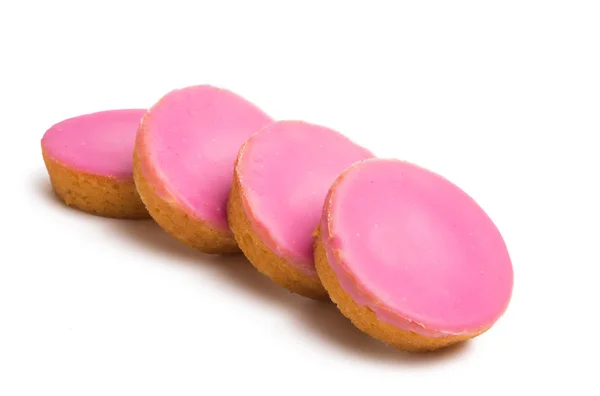 白色背景的粉红色釉上的荷兰饼干 — 图库照片
