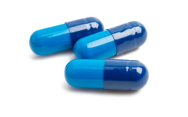 Blauwe capsules geïsoleerd — Stockfoto