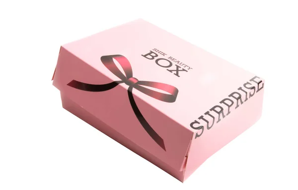 Caixa rosa com uma surpresa isolada — Fotografia de Stock