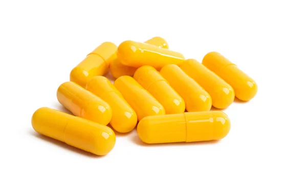 Cápsulas amarelas isoladas — Fotografia de Stock
