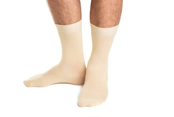 Männliche Beine in Socken isoliert — Stockfoto