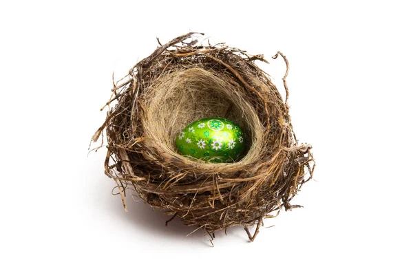 Chocolate egg in a bird's nest — Stock Photo, Image