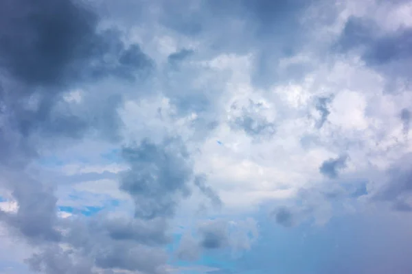 Rainy sky with dark clouds, may be used as background