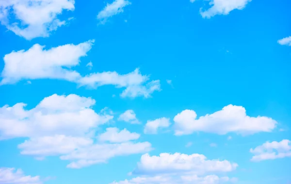 Blue sky with white heap clouds -  background