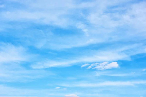 Blue sky with light clouds - background