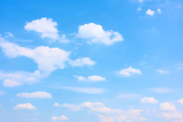 Light blue sky with white clouds. Natural background
