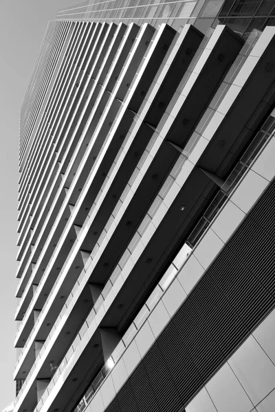 Perspective of high-rise apartment building. Black and white  architectural photography