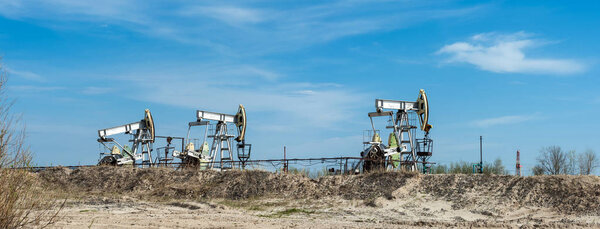 Pump jack. Extraction of oil. Petroleum concept.