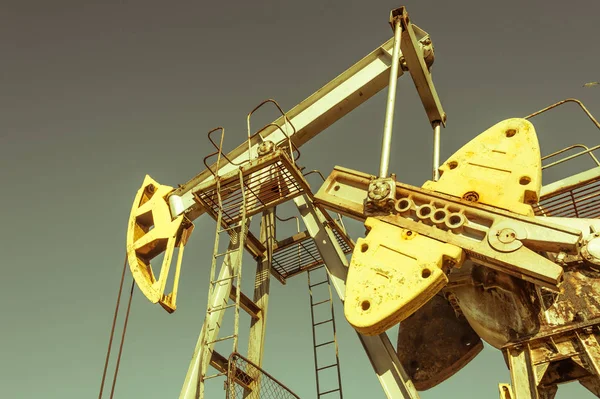 Oil pumpjack, industrial equipment. Rocking machines for power genertion. Extraction of oil. Petroleum concept.