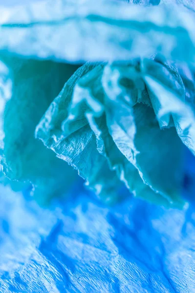 Blue crumpled real vivid paper sheets texture background. Close up. Shallow depth of field. — Stock Photo, Image