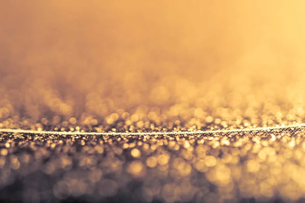 Abstrato fundo dourado brilhante com bokeh e linha fina. Glitter padrão de textura brilhante . — Fotografia de Stock