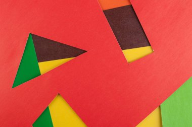 Çok renkli gerçek canlı kağıt sayfalarının arka plan doku. Kırmızı, kahverengi, sarı, turuncu, yeşil.