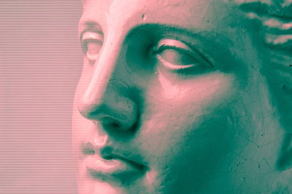 Close up face gypsum copy antique sculpture with craquelure. Red green vaporwave effect. Textured. — Stock Photo, Image