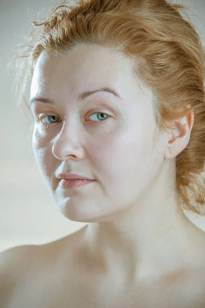 Closeup portrait of a young adult attractive woman with red hair without makeup. Art toning. — Stock Photo, Image