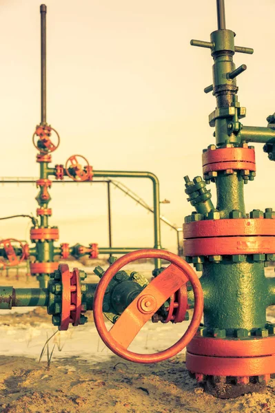 Oil wellhead with valve armature. Oil and gas industry theme. Petroleum concept. Royalty Free Stock Photos