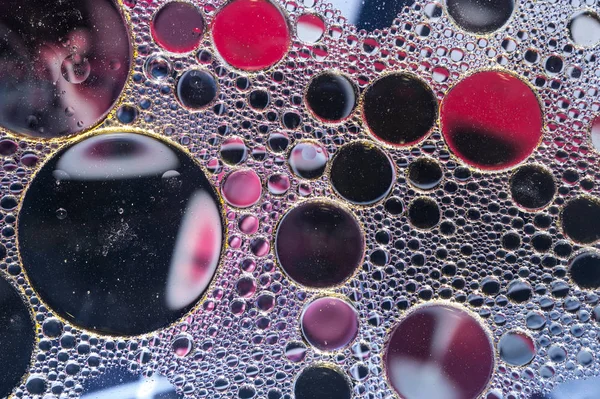 Барвисті масляні чорнильні бульбашки та краплі. Абстрактний шаблон змішаного текстури фону. Візерунок шпалер . — стокове фото