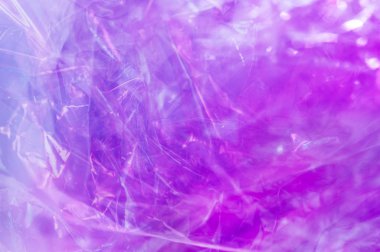 80-90 'ların tarzında holografik arkaplan. Parlak asit renklerinde selofan filmin gerçek dokusu.