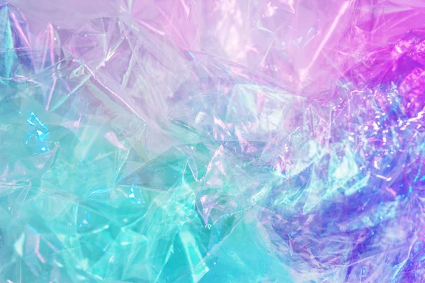 Fundo holográfico no estilo dos anos 80-90. Textura real do filme de celofane em cores de ácido brilhante. — Fotografia de Stock