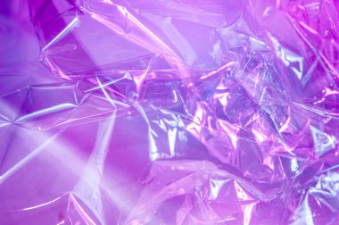 80-90 'ların tarzında holografik arkaplan. Parlak asit renklerinde selofan filmin gerçek dokusu.