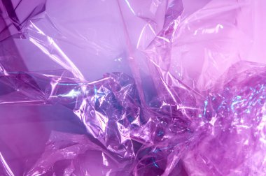 80-90 'ların tarzında holografik arkaplan. Parlak asit renklerinde selofan filmin gerçek dokusu.