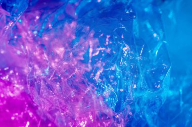 80-90 'ların tarzında holografik arkaplan. Parlak asit renklerinde selofan filmin gerçek dokusu.