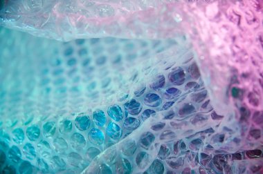 80-90'lar tarzında holografik arka plan. Parlak asit renklerde kabarcık şal film gerçek doku.