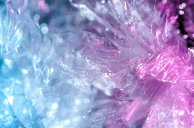 80-90 'ların tarzında holografik arkaplan. Parlak asit renklerinde selofan filmin gerçek dokusu.