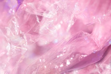 80-90 'ların tarzında holografik arkaplan. Parlak asit renklerinde selofan filmin gerçek dokusu.