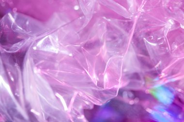 80-90 'ların tarzında holografik arkaplan. Parlak asit renklerinde selofan filmin gerçek dokusu.