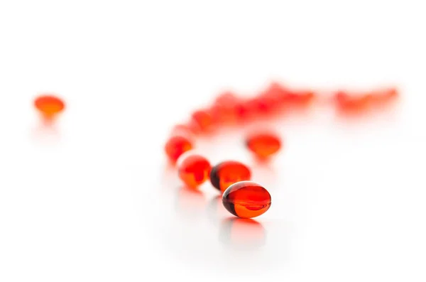 Red Gel Capsules Selective Focus Isolated White Background — Stock Photo, Image