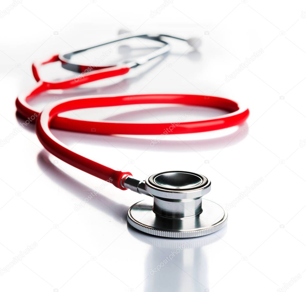 red stethoscope on white background