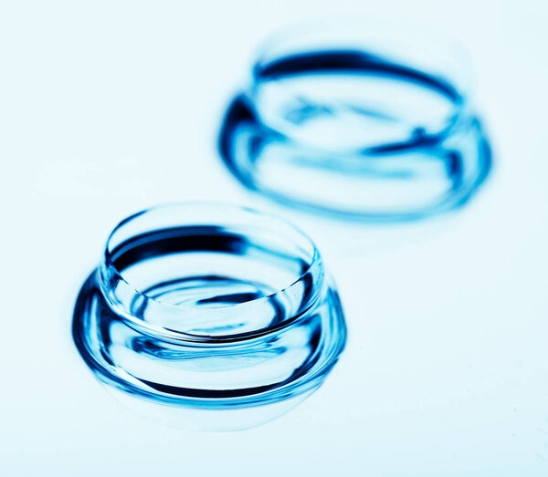 Two contact lenses with reflections
