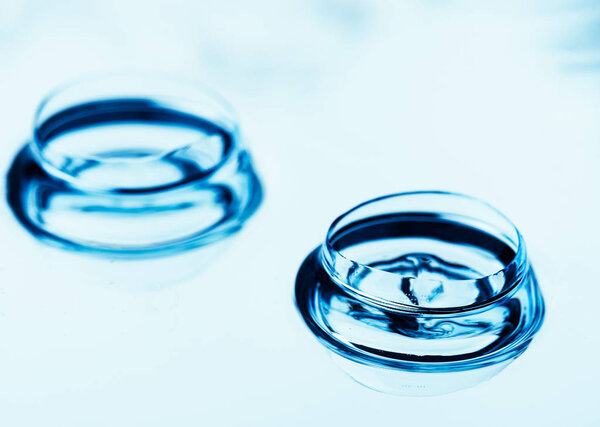 Two contact lenses with reflections