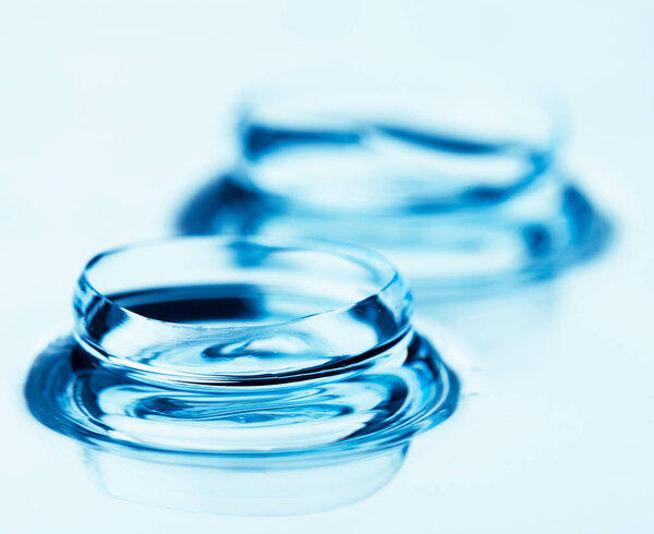 Two contact lenses with reflections