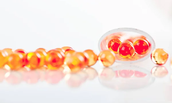 Shiny Yellow Vitamin Fish Oil Capsule Spilling Out Pill Bottle — Stock Photo, Image