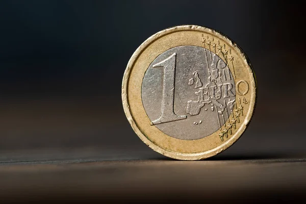 One euro coin on the des — Stock Photo, Image