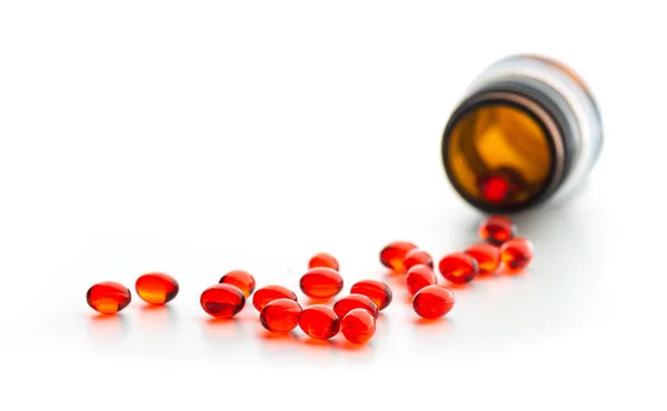 Red Capsules Pill Bottle Isolated Whit — Stock Photo, Image