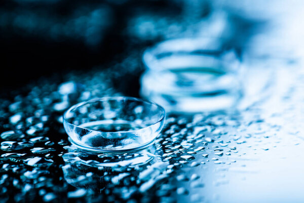 Two contact lenses with reflection