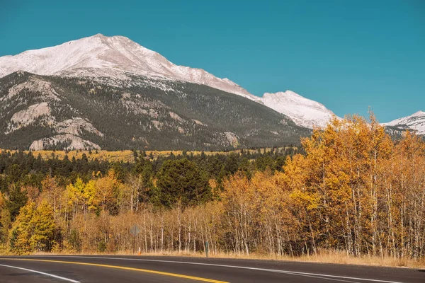 Season changing from autumn to winter. Highway in Colorado, USA.