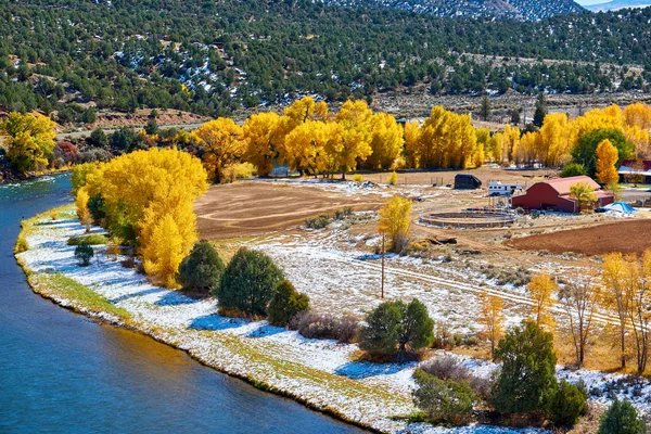 Season changing, first snow and autumn trees. Rocky Mountains, Colorado, USA.