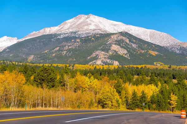 Season changing from autumn to winter. Highway in Colorado, USA.