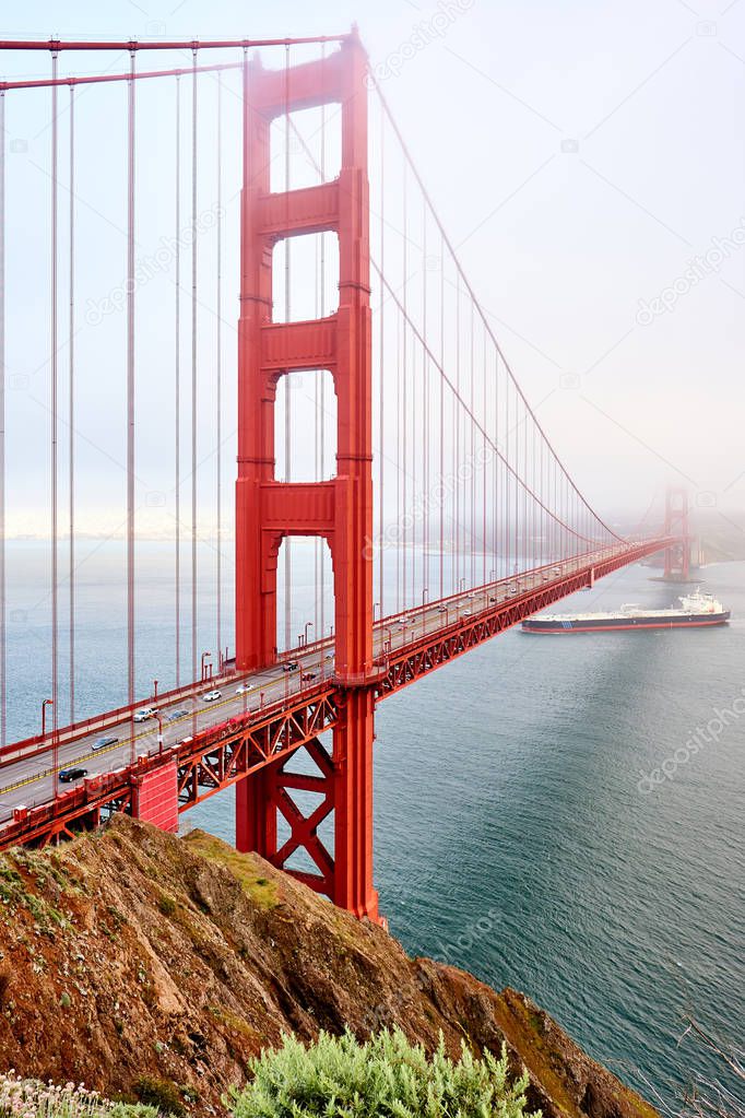 Golden Gate Bridge view at foggy day, San Francisco, California, USA.