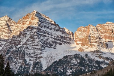 Scenic view of snow covered Maroon Bells mountains, Colorado Rocky Mountains, USA.  clipart