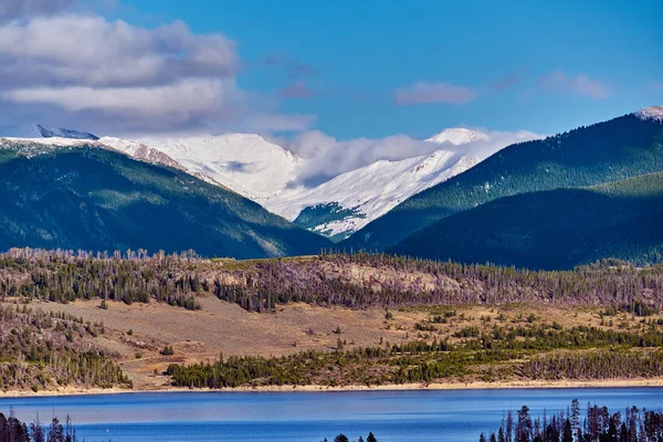 View of forest on mountains and calm lake, Rocky Mountains, Colorado, USA.