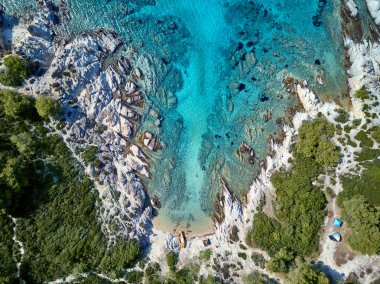 Beautiful beach and rocky coastline top aerial view drone shot, Sithonia, Greece clipart