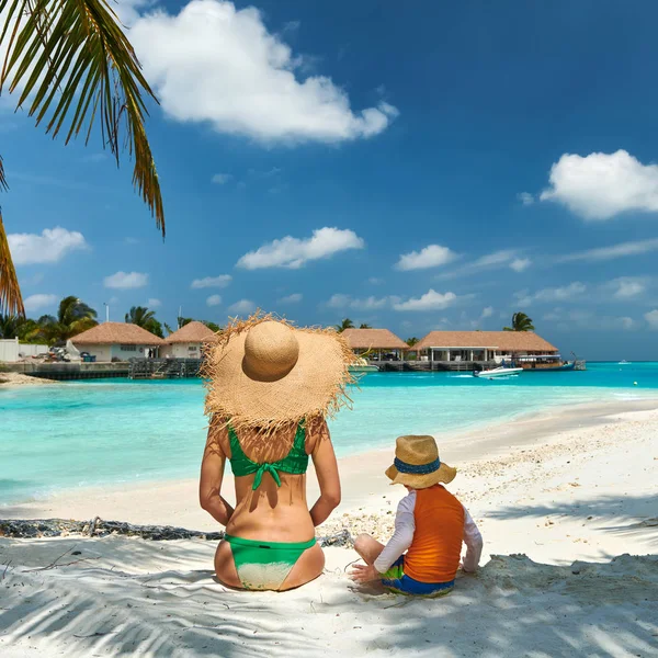 Toddler boy on beach with mother — Stock Photo, Image