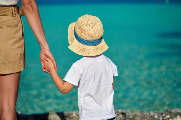 Toddler boy on beach with mother — Stock Photo, Image