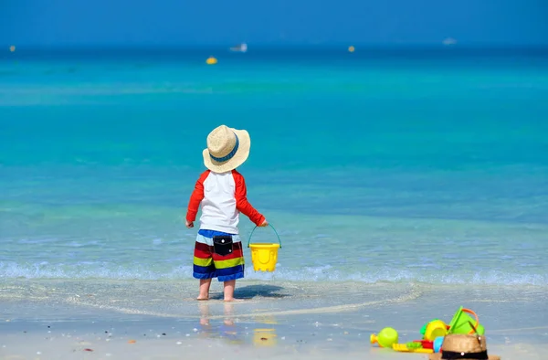 Two year old toddler playing on beach — Stock Photo, Image