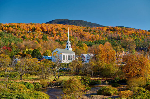Iconic New England church in Stowe town at autumn